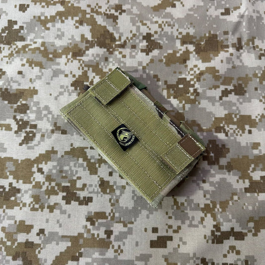 Front of the olive Garmin M650 GPS flip pouch showing its hook-and-loop closure strap and branded patch.