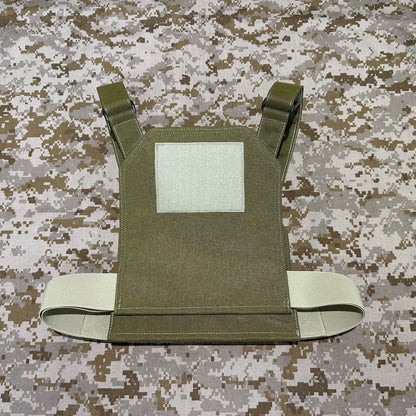 Back view of the olive plate carrier showing a square hook-and-loop panel, shoulder straps and adjustable side cummerbund.